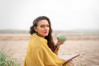 Mimmi Demetri von Pezold drinks tea upon a East Lothian beach