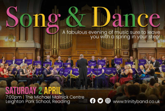 Background image shows Trinity Concert Band on stage at the Reading University Great Hall. Text over the image provides details of the Song & Dance concert.