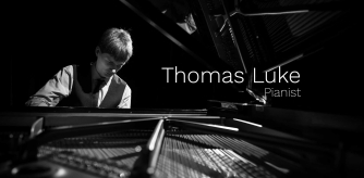 Thomas Luke playing the piano