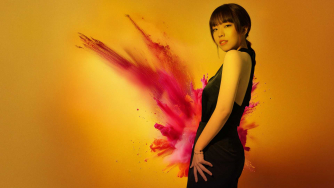Junyan Chen against a backdrop of exploding colour