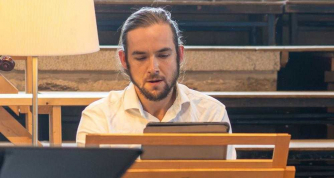 Seb Gillot directing and playing the harpsichord