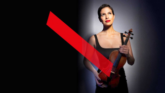 Elena Urioste holding her violin