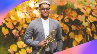 Aaron Azunda Akugbo holding a trumpet