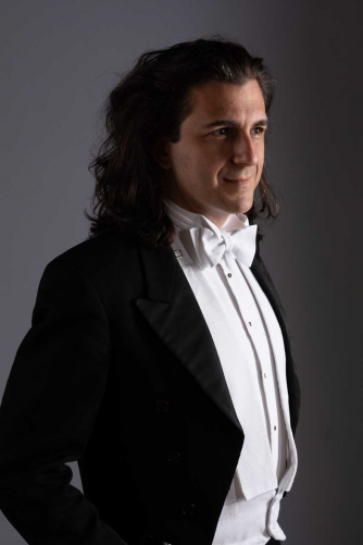 Panos Karan pianist in white tie and tails
