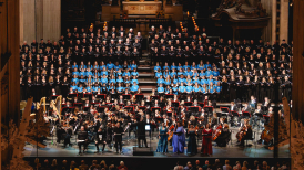 The Bach Choir singing on stage at St Paul's Cathedral